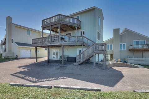 Spacious beach house with multiple levels, wrap-around decks, and convenient parking for your coastal getaway.
