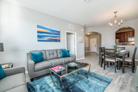 Seamless Living: The living room flows effortlessly into the dining area and kitchen, creating a spacious and inviting environment where gatherings thrive and memories are made.