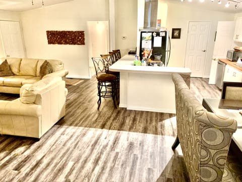 Living room, dining and kitchen areas.