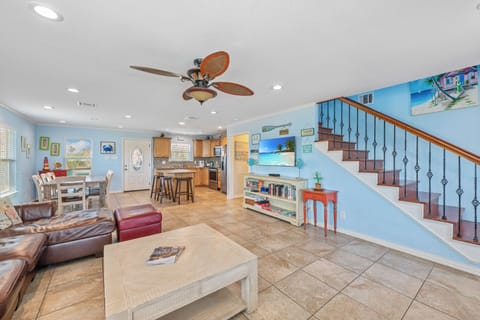 Coastal charm meets comfort in this inviting, spacious living area designed for effortless relaxation.