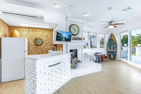 Indoor bar and lounge area with views of the pool