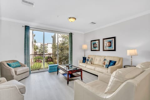 Inviting Living Room: Enjoy a breath of fresh air as you open the sliding doors in this refreshing townhouse space.