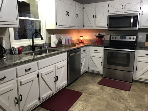 Large kitchen with stainless appliances
Refrigerator with icemaker
Dishwasher