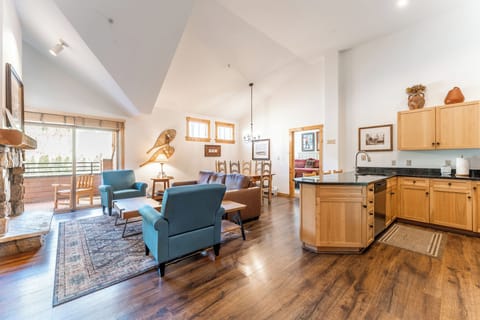 You'll love this open-concept space where rich hardwood floors flow between your cozy living area and full kitchen, perfect for memorable evenings.