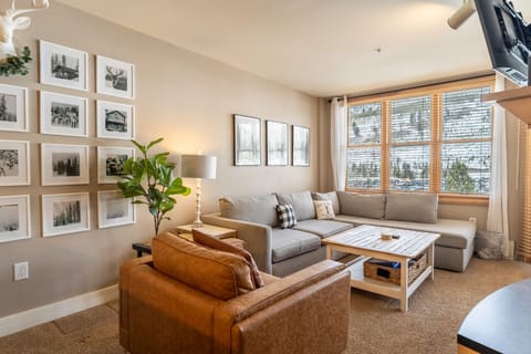 Sink into plush seating surrounded by curated artwork and warm natural light streaming through your windows.