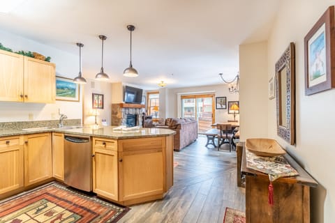 Your open-concept kitchen flows seamlessly into the cozy living area, perfect for gathering with loved ones while preparing meals.