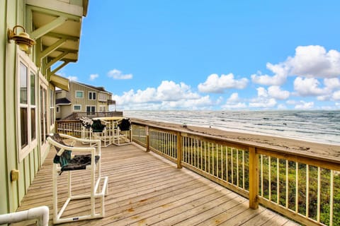 Step onto your private oceanfront deck where waves meet endless blue skies and comfortable seating awaits your peaceful moments.