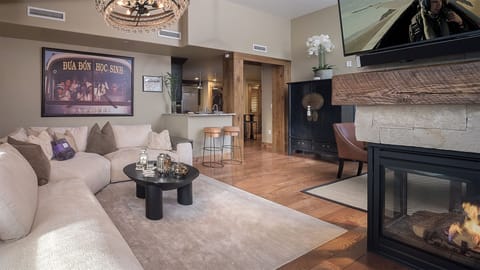 Unwind in your luxurious living space with a cozy fireplace, plush sectional seating, and modern amenities creating the perfect retreat.