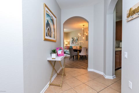 Traverse the inviting hallway, where every step unveils a path of comfort and elegance, beckoning you deeper into a world of tranquility and style.
