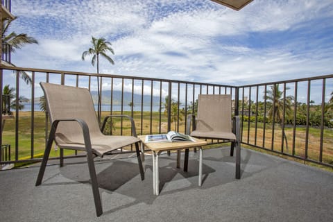Relax on your private balcony with sweeping ocean and mountain views—perfect for morning coffee or watching sailboats drift across the bay.