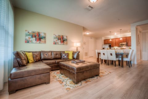 Sublime living area of the condo in Orlando - Experience the modern comfort while relaxing in the spacious living area - Relax and unwind in this inviting space designed for cozy evening with amazing sofa arrangement - Create unforgettable memories