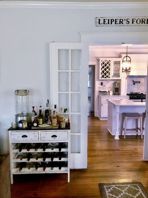 Pull up a bar stool & sit at the kitchen island.