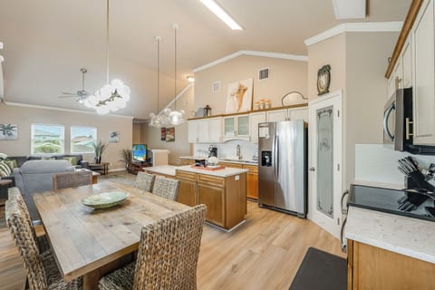 Kitchen looking into living area - The kitchen, dining, and living areas blend seamlessly for a bright and airy feel