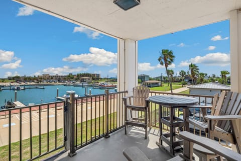 Sip your morning coffee while watching boats drift by from your private waterfront balcony, with stunning marina views stretching across the harbor.