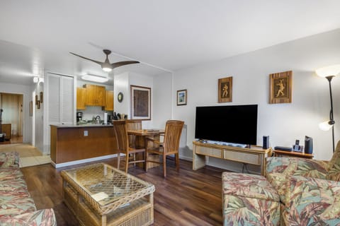 Relax in your spacious open-concept living area with tropical decor, fully equipped kitchen, and comfortable seating—perfect for unwinding after island adventures.