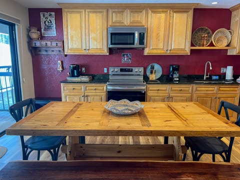A view of the dining table and our recently renovated kitchen