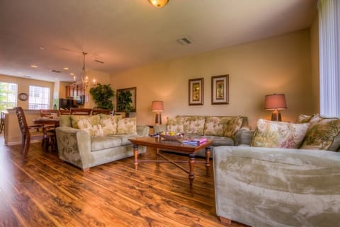 Inviting living room is professionally designed and decorated to give our guests airy feel throughout the home.