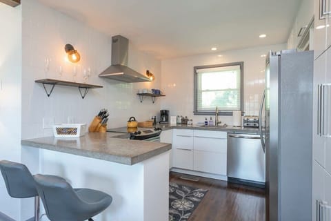 Full kitchen with stainless steel appliances - has everything you need to cook your favorite meals.