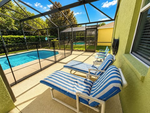 Pool area showing sun loungers.