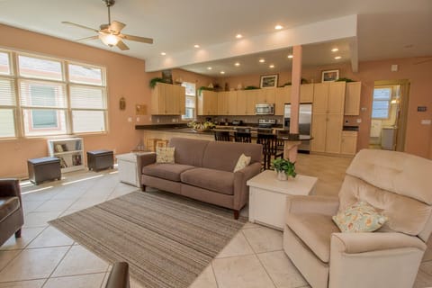 Main Level | Living Room - Enter into the open living, dining, and kitchen area.  This is great for gathering the entire family all into one room.
