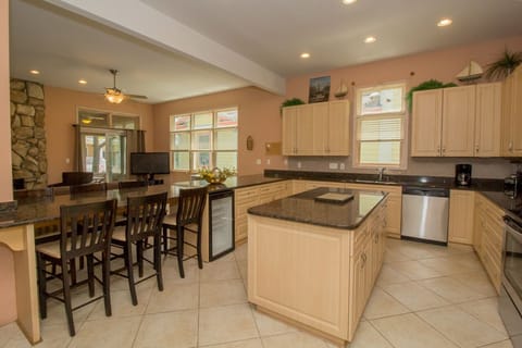 Main Level | Kitchen - The breakfast bar area has 6 extra chairs for additional seating.  Need more?  Not to worry!  Just pull up a few more chairs and you are all set!