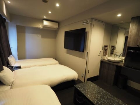 Triple Room | Desk, blackout drapes, iron/ironing board, free WiFi