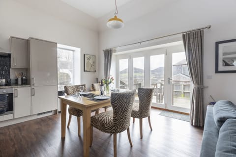 Stables - folding doors leading out to the terrace from the kitchen area