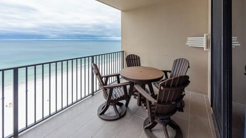 Enjoy meals or morning coffee at the round table while taking in the expansive water views from your balcony
