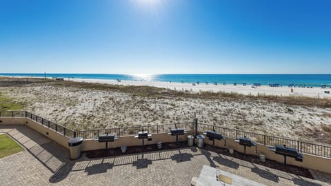 Grill and relax at the pool area while enjoying the serene view of the beach and sparkling water just steps away