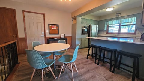 Another view of the dining and kitchen area.