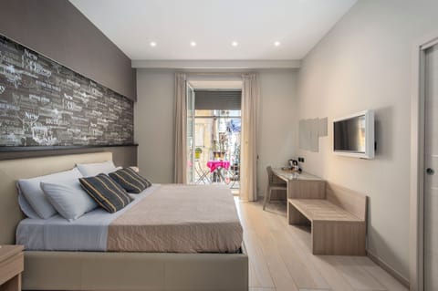 Comfort Quadruple Room | Premium bedding, in-room safe, desk, soundproofing