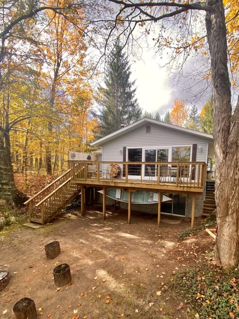 Cabin exterior with spacious deck overlooking the scenic Betsie River