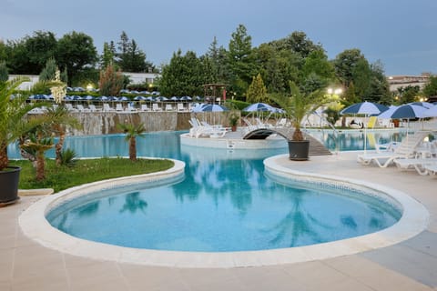Indoor pool, seasonal outdoor pool, pool umbrellas, sun loungers