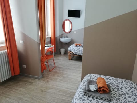 Economy Twin Room, Accessible, Shared Bathroom | Down comforters, individually decorated, desk, blackout drapes