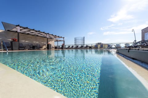 Seasonal outdoor pool, open 10:00 AM to 7:30 PM, sun loungers