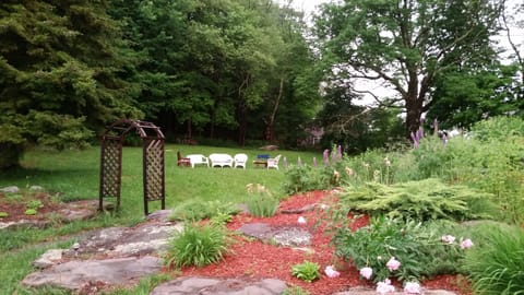 Backyard fire pit and flower gardens. Plenty of room for the kids to play!