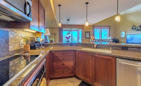 Granite countertops and African Mahogany Cabinets.