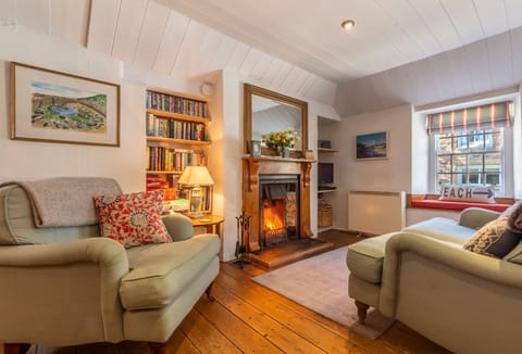 Open plan sitting room with wood burning stove