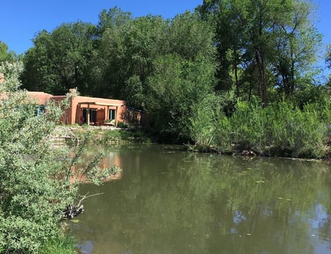Adobe Casita on the half acre pond on our eco solar 8 acres of lush trails