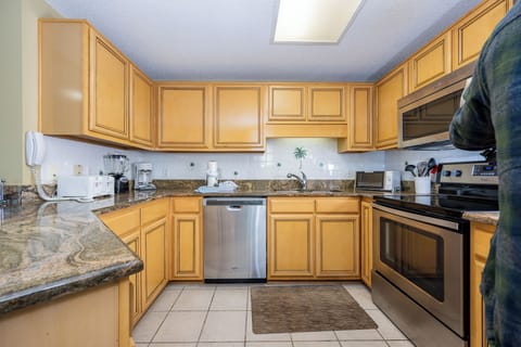 Prepare your favorite meals in this spacious kitchen featuring ample counter space and stainless appliances