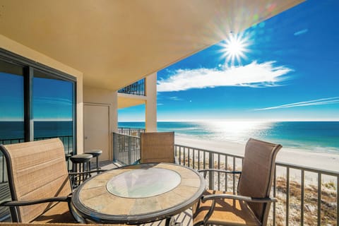 Enjoy meals or drinks at the round table while soaking in the expansive beach views from your outdoor seating area