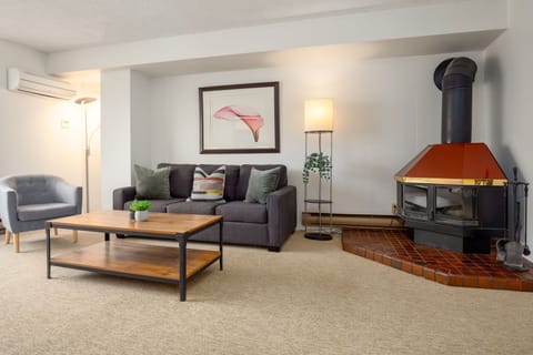 Relax in the bright living room with a large bay window, smart TV. 
* Kindly note the fireplace has been decommissioned as of June 2026 & cannot be used.