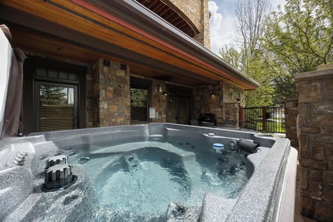 Slip into your private hot tub on the covered patio, where warm jets ease tension while you take in peaceful treetop views and mountain air.