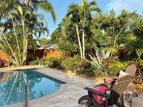 Adirondack chairs overlooking the pool and gardens