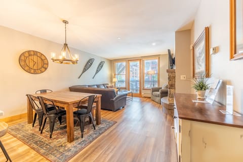 Settle into your spacious open-concept retreat where warm wood floors and mountain-inspired decor create the perfect après-ski atmosphere.