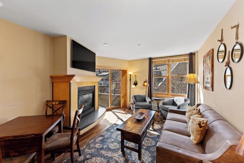 Cozy up by your fireplace while natural light streams through windows into your comfortable living space.