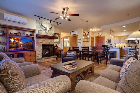 Cozy up in this inviting living space where rustic charm meets modern comfort, perfect for relaxing after your mountain adventures.