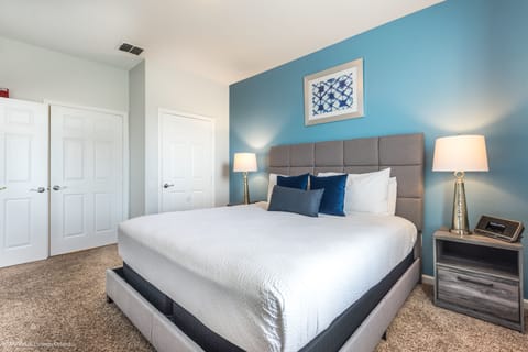 Step into this serene bedroom, where every detail whispers of relaxation and rejuvenation.