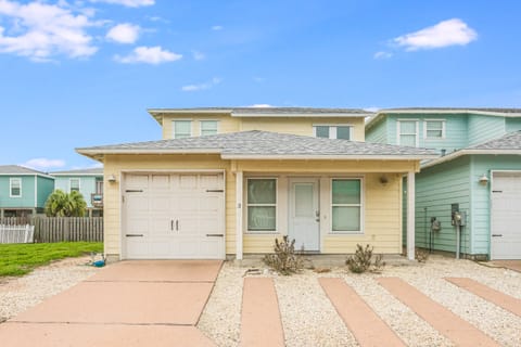 Charming coastal home with garage parking in a vibrant beachside community setting.