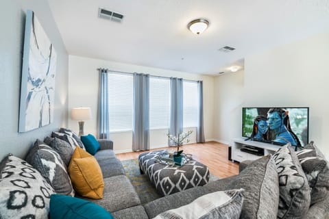 Step into sophistication in our living and entertainment room, where the subtle touch of gray colors sets the stage for refined relaxation and stylish entertainment.
